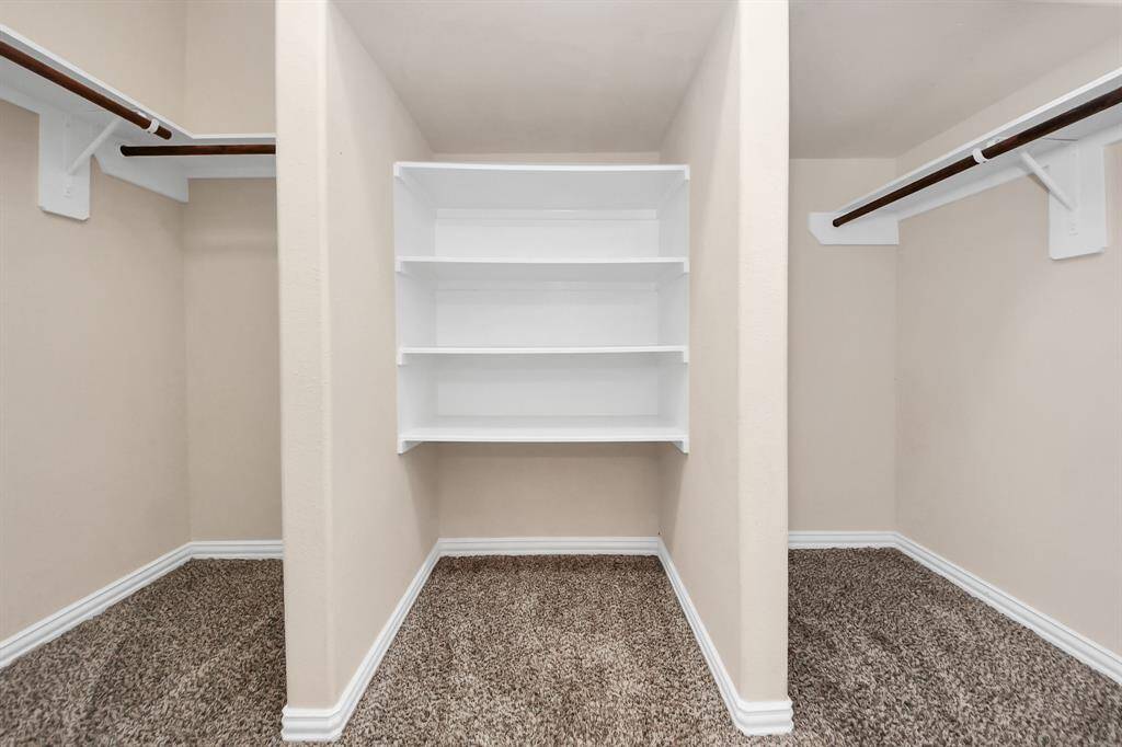 Walk-in closet in primary bedroom