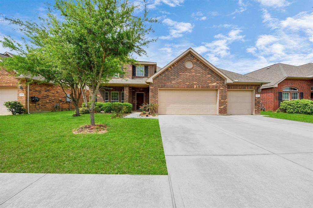 3 car garage and extra parking space for your convenience