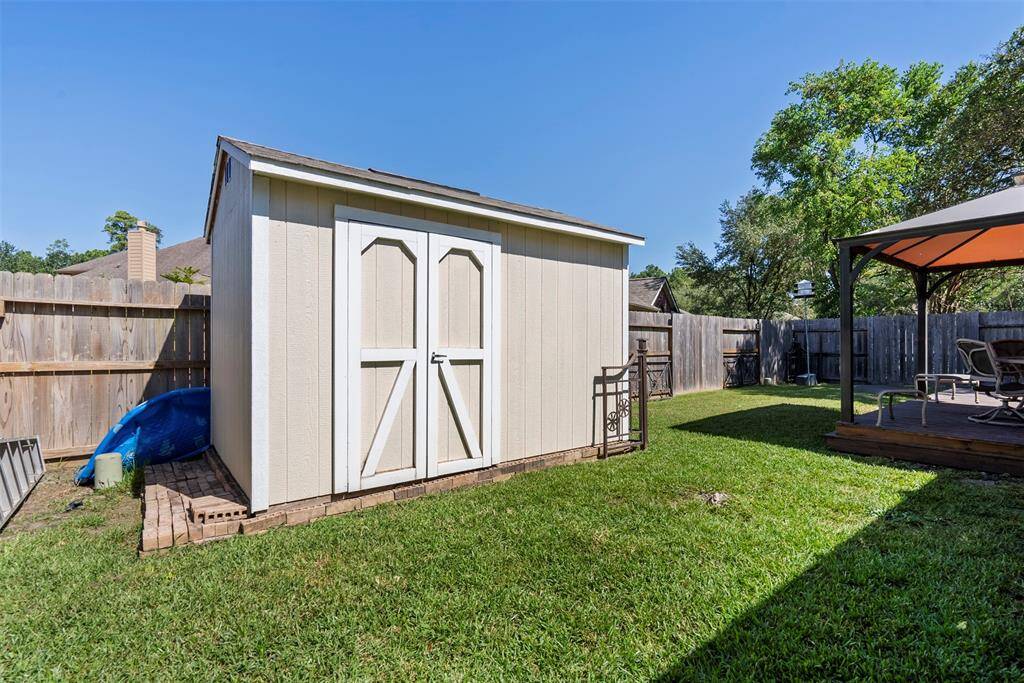 The storage shed allows for additional workspace or lawn-care storage