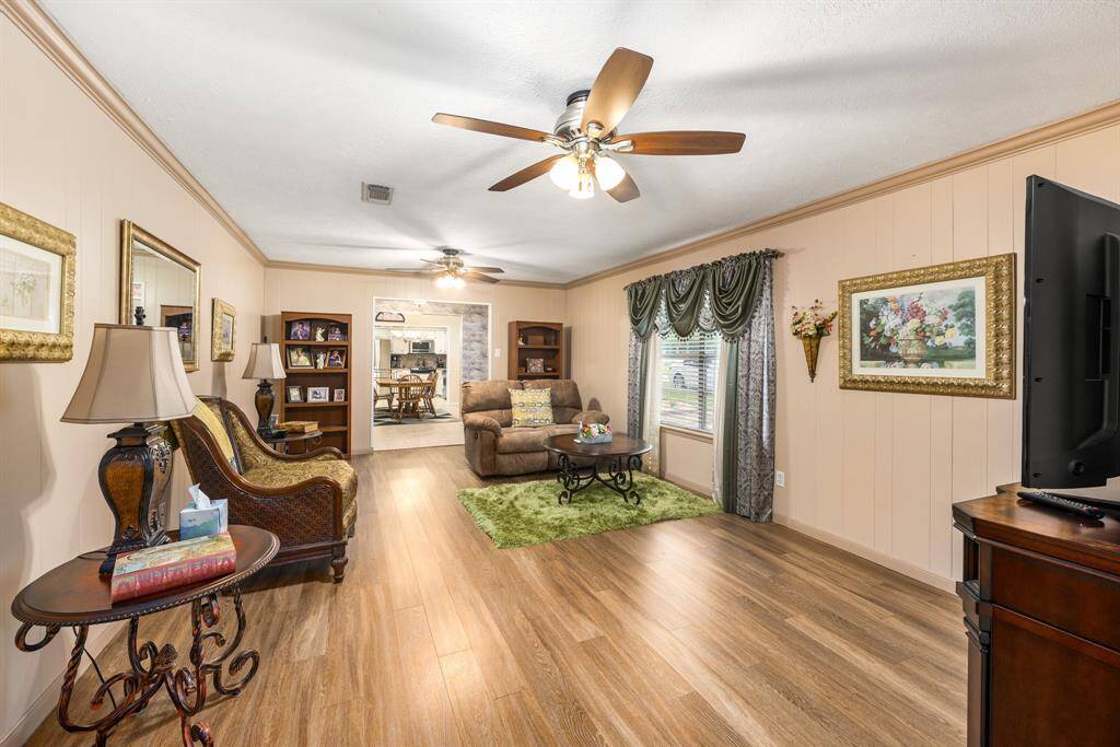 Living room, looking through entry hall, dinning and kitchen.  Open space with lots of sunlight.