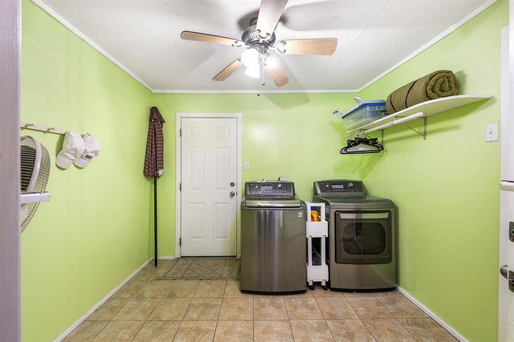 Utility room with door leading to back deck