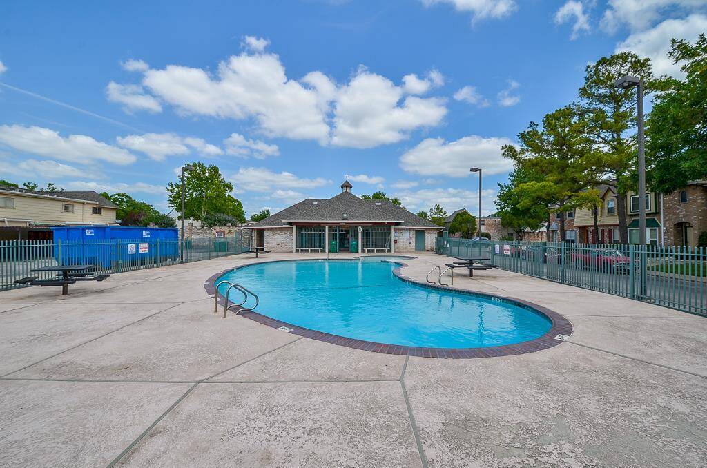Enjoy a refreshing swim in the inviting pool or relax in the serene park setting, perfect for leisure and recreation.