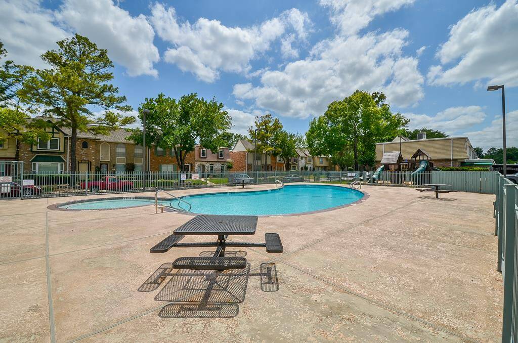 Enjoy this inviting community oasis featuring a sparkling pool, perfect for relaxing and entertaining in a picturesque setting.