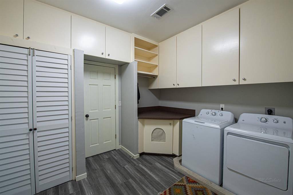 Huge laundry room with plenty of storage