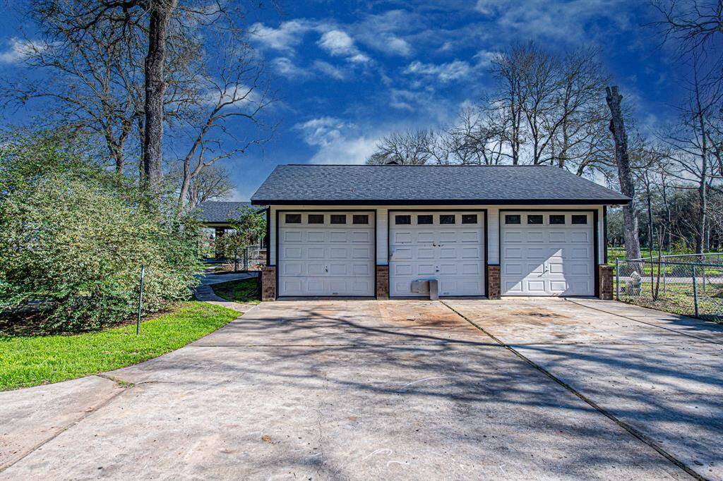 Three car garage with additional parking space