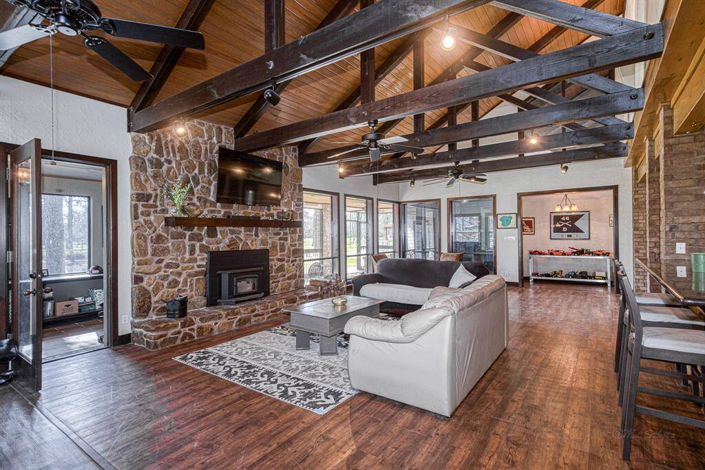 Large family room with vaulted wood beamed ceilings