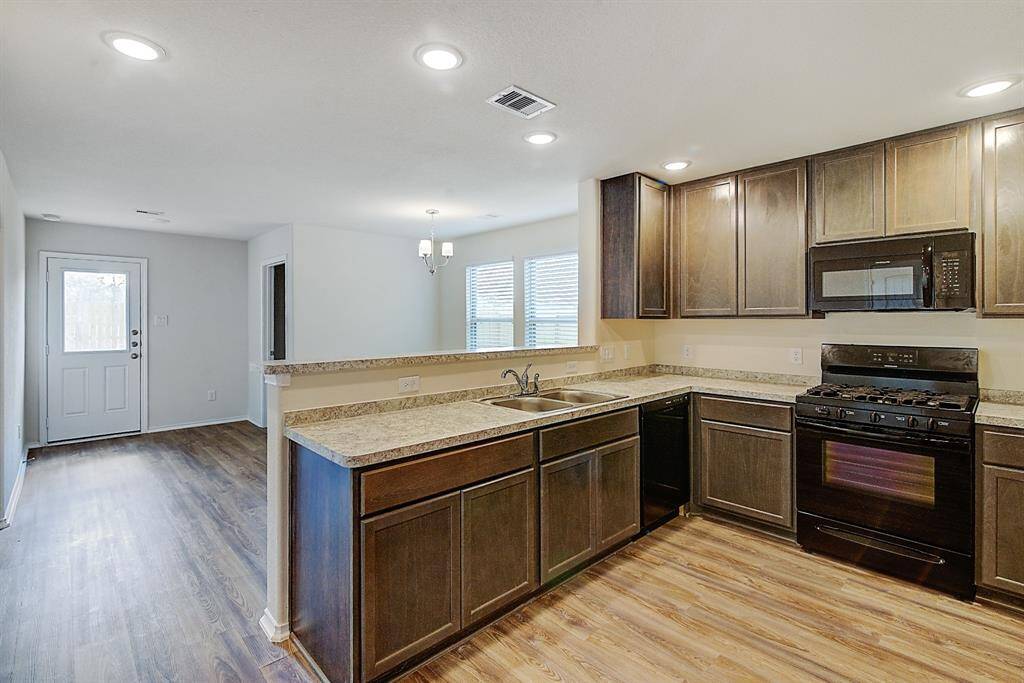 kitchen with view of living and dining rooms