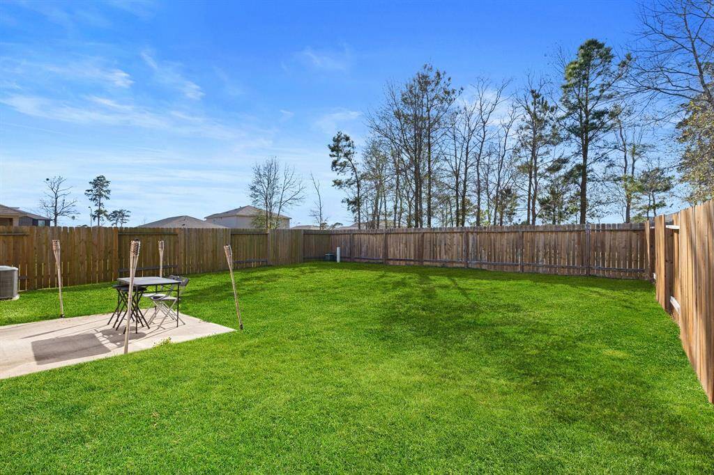 This backyard is perfect for family gatherings, social events, or simply unwinding in the fresh air.