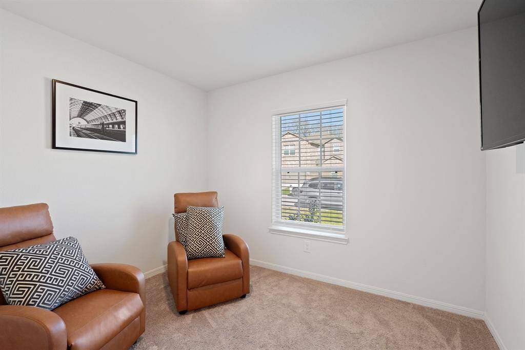 Your secondary bedroom features plush carpet, fresh paint, closet, and a large window that lets in plenty of natural lighting.