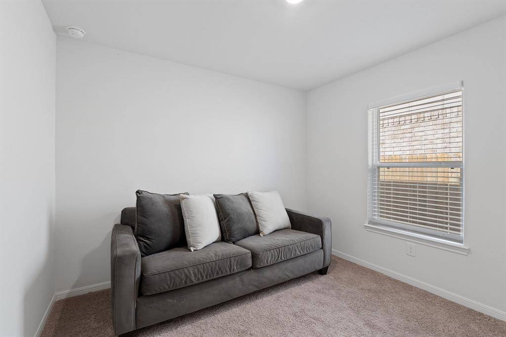Your secondary bedroom features plush carpet, fresh paint, closet, and a large window that lets in plenty of natural lighting.