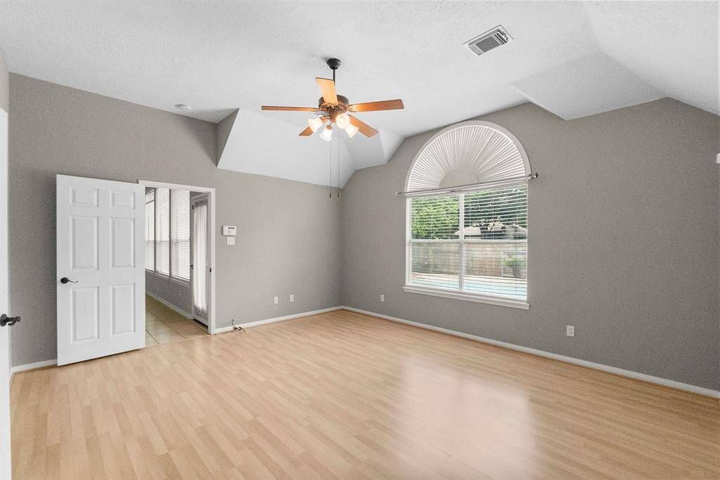 Primary bedroom with large window