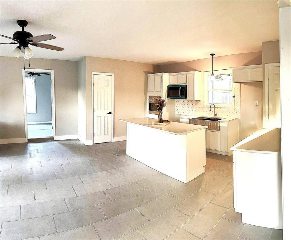Kitchen opens to dining area