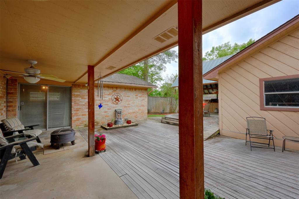 Large covered back porch with decking for plenty of seating areas.