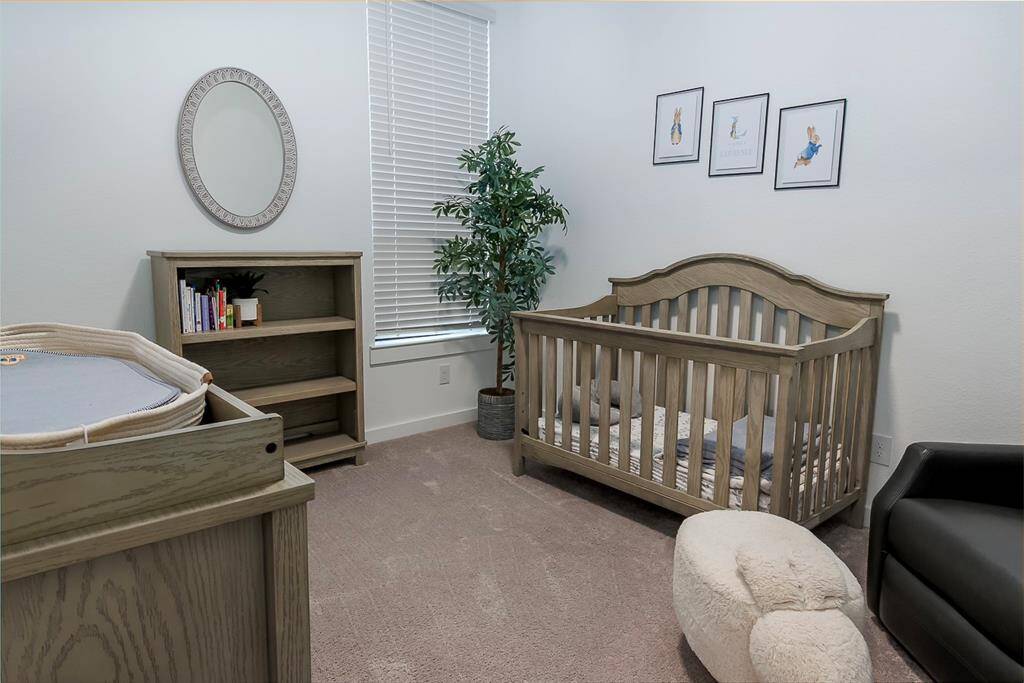Cozy and accessible downstairs bedroom, perfect for guests or as a nursery.