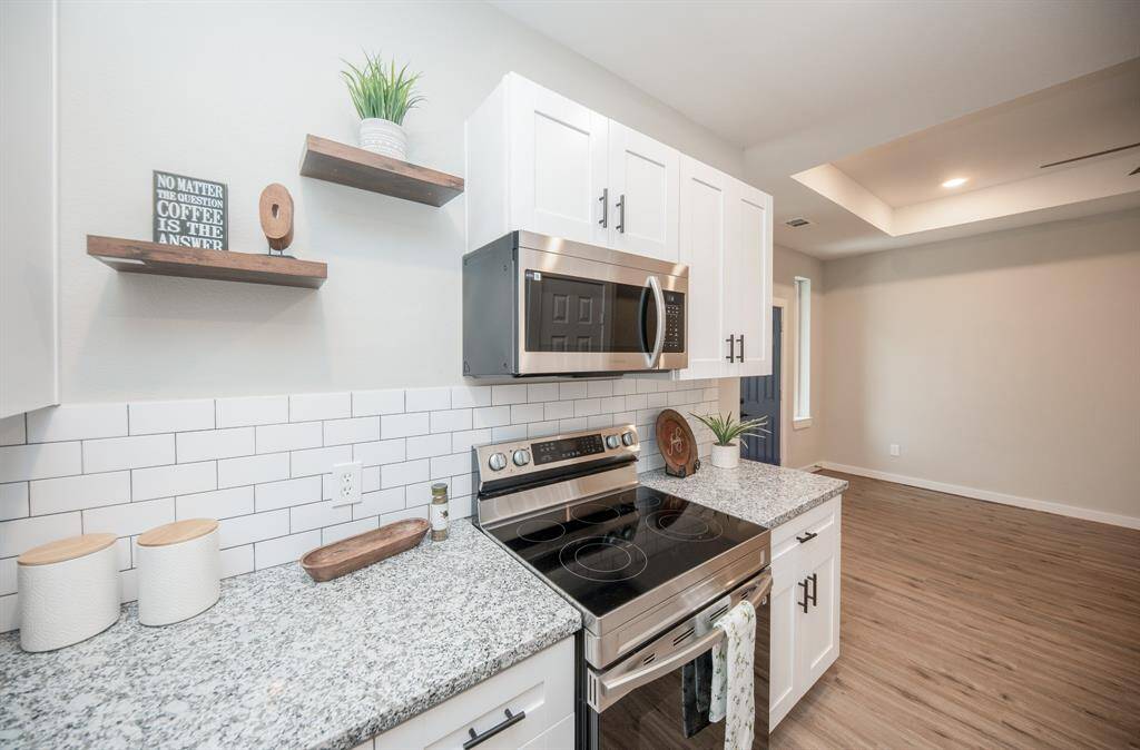 Love the floating shelves and counter space.