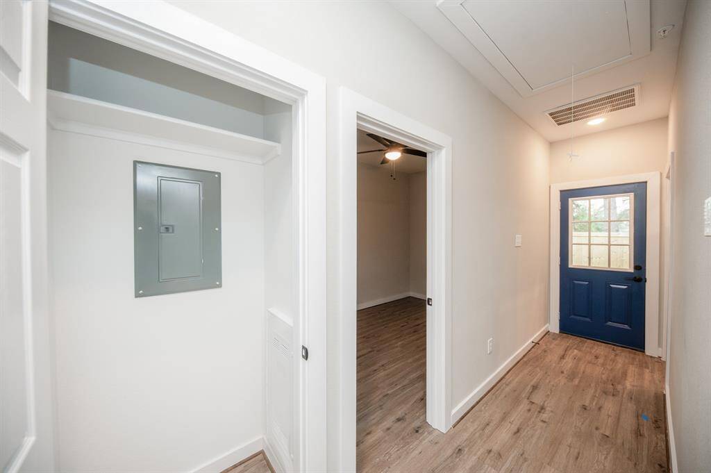 Storage closet and back door to covered patio