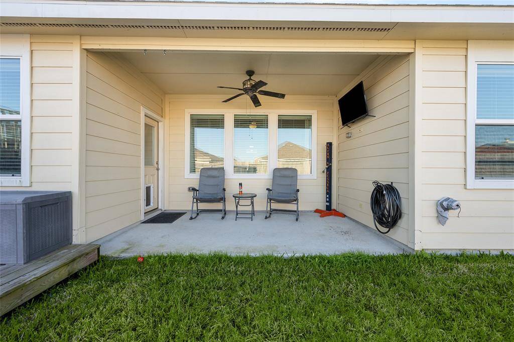 Cozy covered patio area with fan
