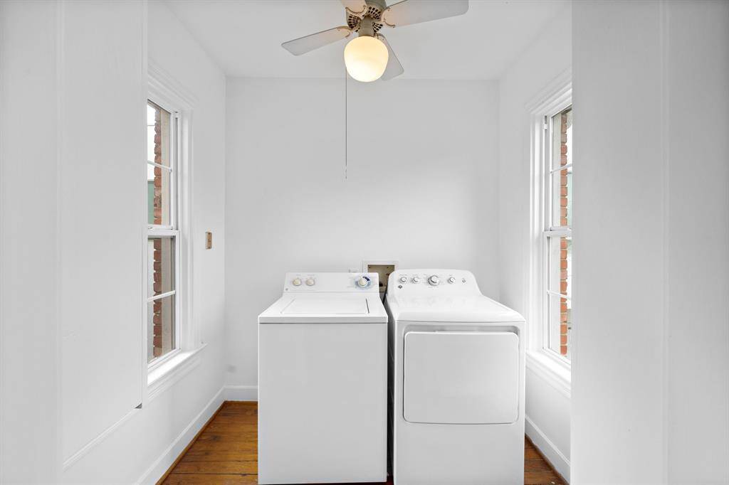 Full sized appliances in a huge utility room.