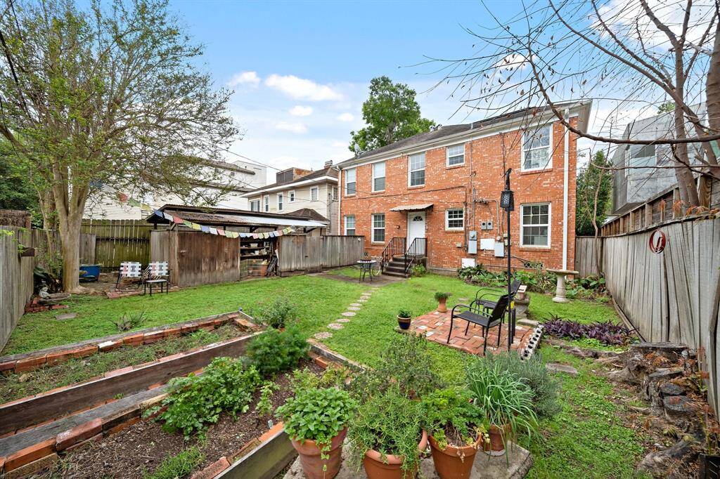 Backyard has raised planter beds, sitting area lots of space to relax. Shared space with downstairs tenants.