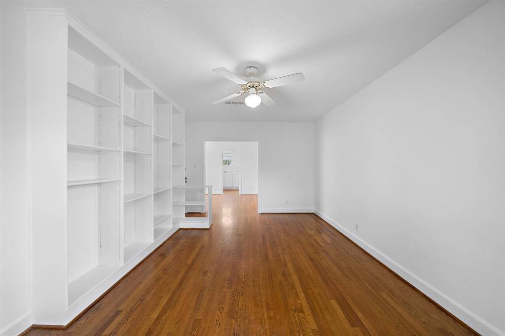 The living room is quite large with a wall of built-ins.