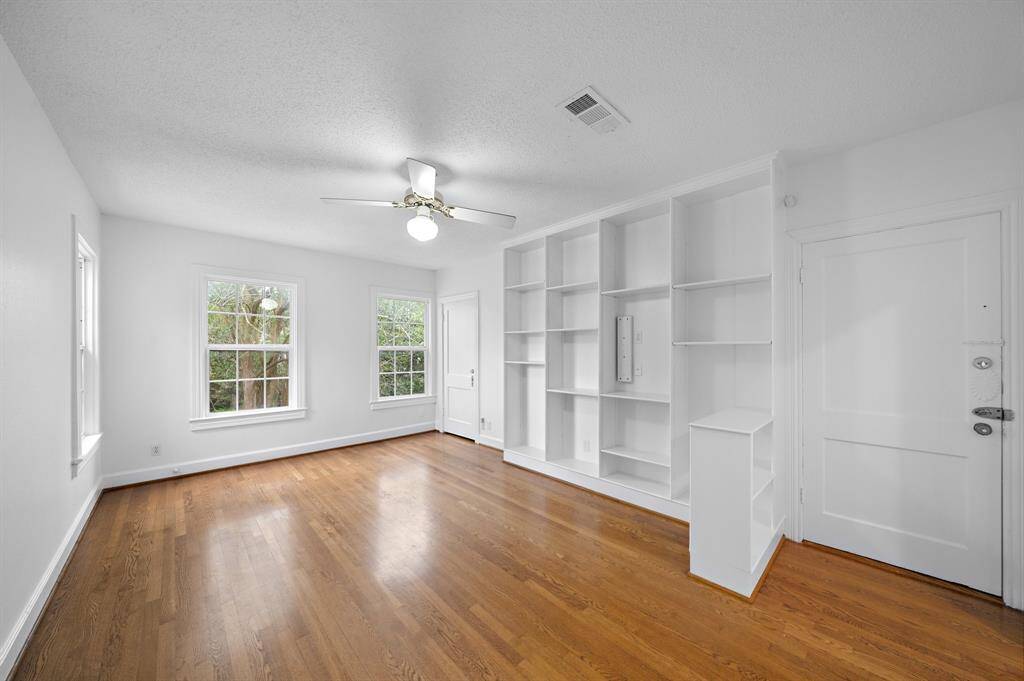 Living room with windows facing the front of the property.
