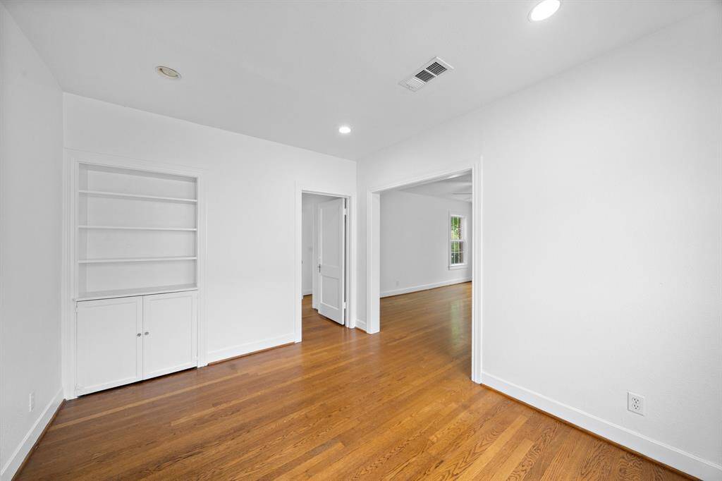 The dining room has a built-in cabinet for dishes.