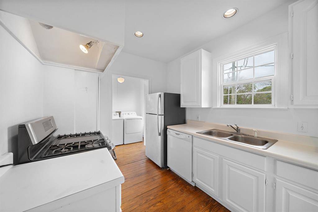 Large kitchen with a window over the sink facing backyard. Gas stove too!