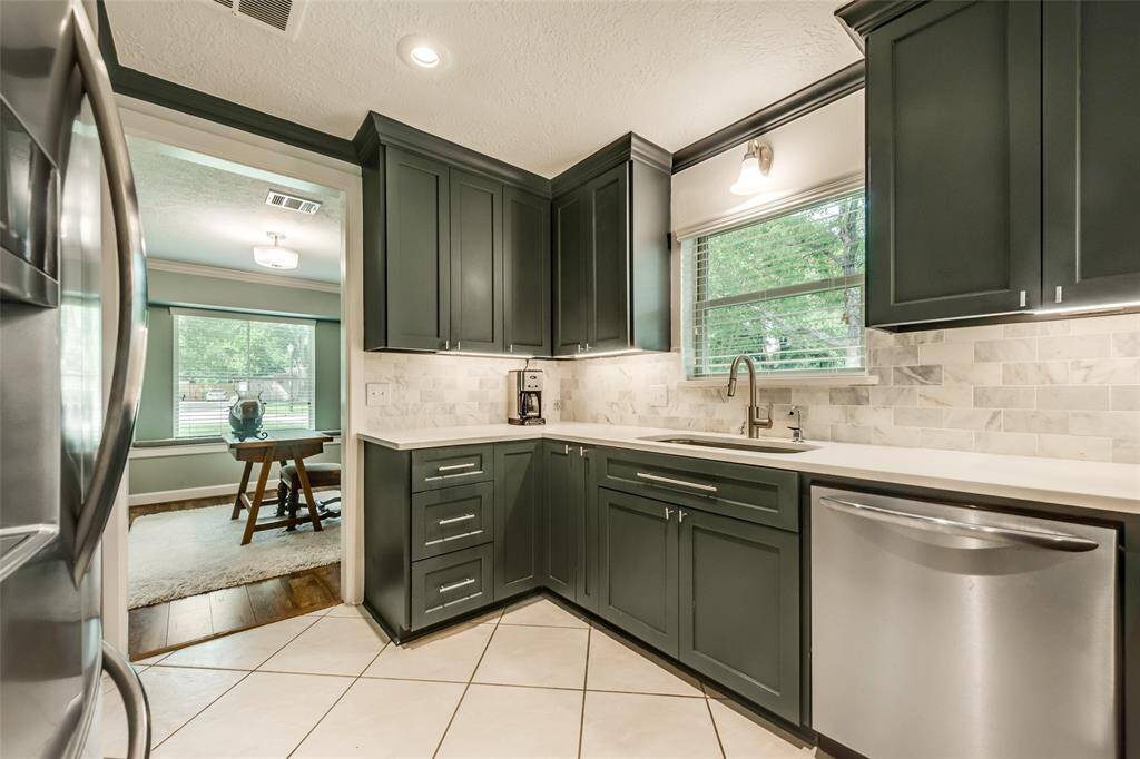 New custom cabinets, upgraded appliances, large basin sink, and quartz counters create an amazing kitchen!