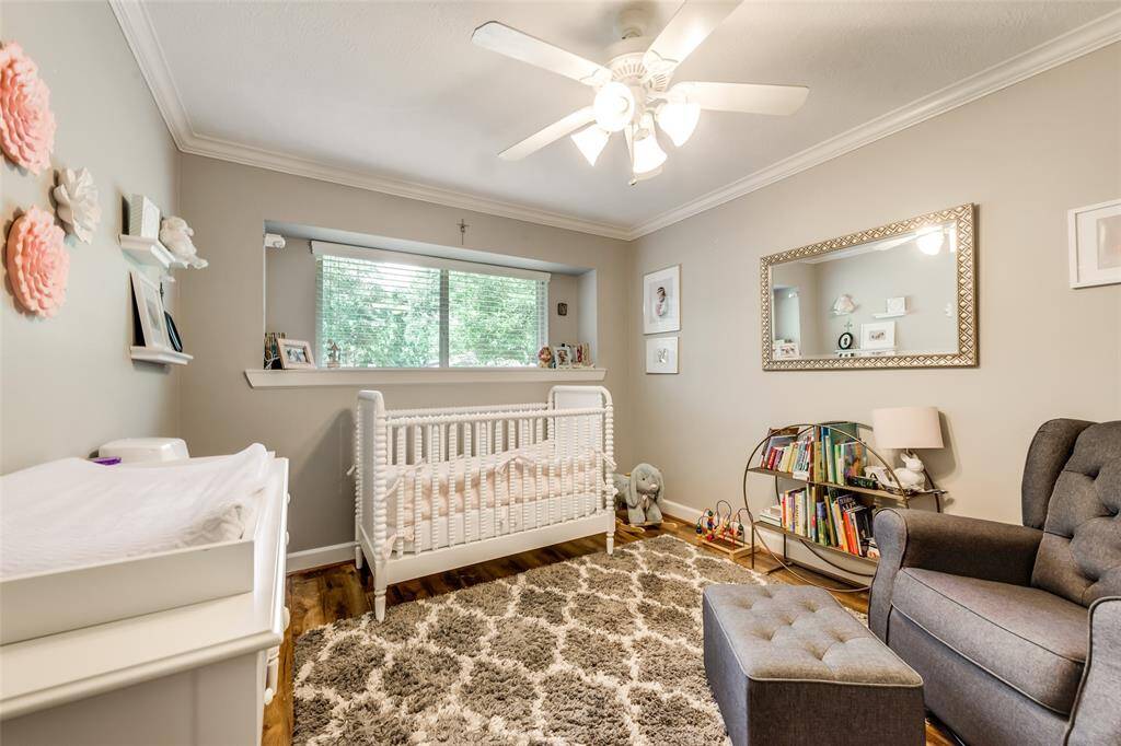Feature windows and trim detail upgrade this secondary bedroom.