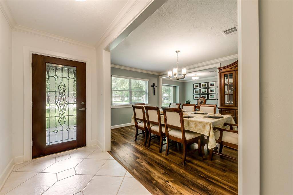 The light-filled front entry welcomes you to the formal dining and living rooms at the front of the house.