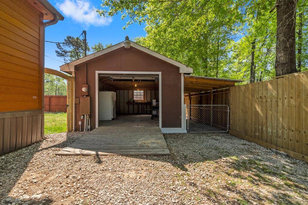 A versatile detached garage provides additional storage and potential for workshop space.