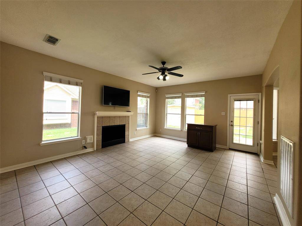 Spacious Den or Family room with fire place and plenty or natural light