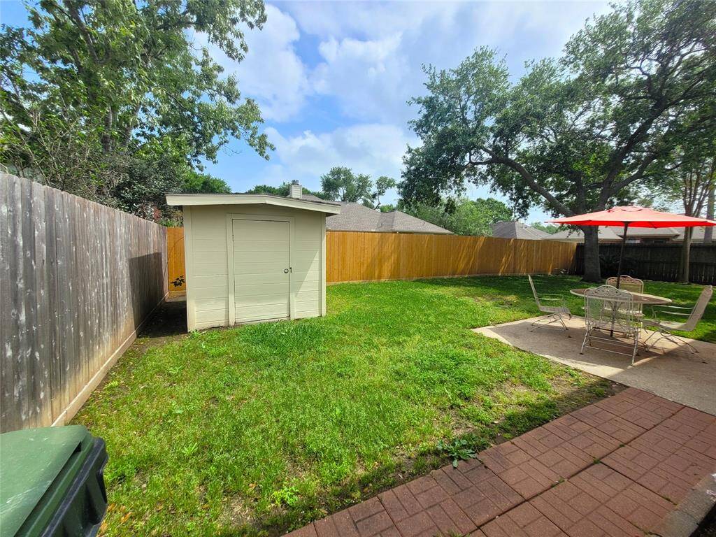 Nice back yard with more storage.