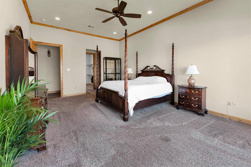 Escape to your private sanctuary in this elegant owner’s retreat, where breathtaking views and warm, inviting finishes create the perfect blend of comfort and style. Custom closets fit for royalty keep everything beautifully organized, while the spa-like ensuite offers a tranquil space to relax and recharge.