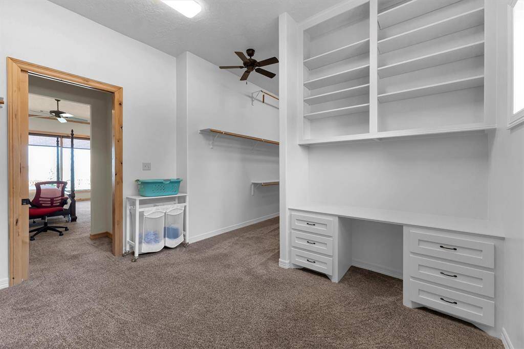 Shop until you drop—there’s room for it all! Dual closets, measuring approximately 22x14, are outfitted with custom built-ins to easily accommodate your seasonal wardrobe, active gear, and everyday essentials, all perfectly organized and within reach.