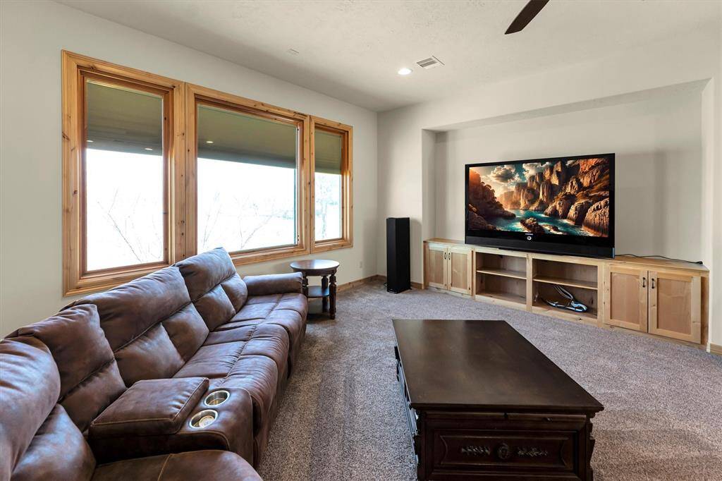This fun and spacious game room is perfect for summer slumber parties and lively game nights. There's plenty of room for your favorite game room furnishings, a cozy nook for your big screen setup, and picture-perfect views that make it a space everyone will want to hang out in.