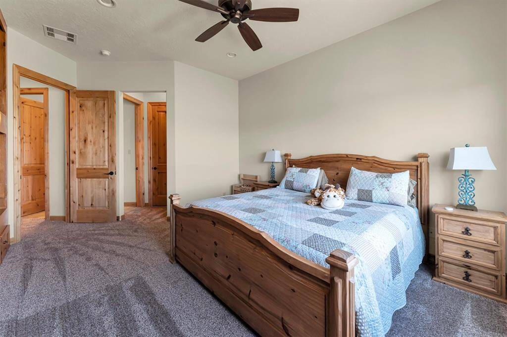 This inviting guest suite offers plenty of space for a king bed, built-in bunks and showcases beautiful views that create a relaxing retreat. Guests will appreciate the comfort and convenience of a private ensuite bathroom and a generous walk-in closet.