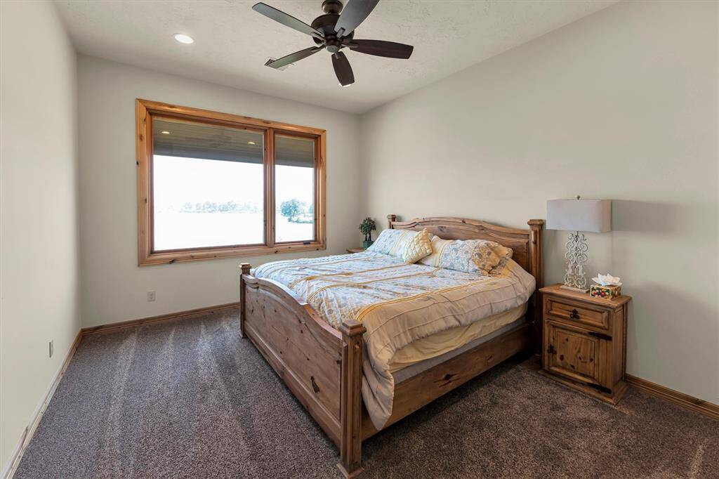Your family or guests will rest easy in this spacious suite, featuring soft carpet and paint, a large picture window, and a raised ceiling with a cooling fan. A large walk-in closet and a beautifully appointed ensuite bathroom add comfort and convenience to this welcoming retreat.