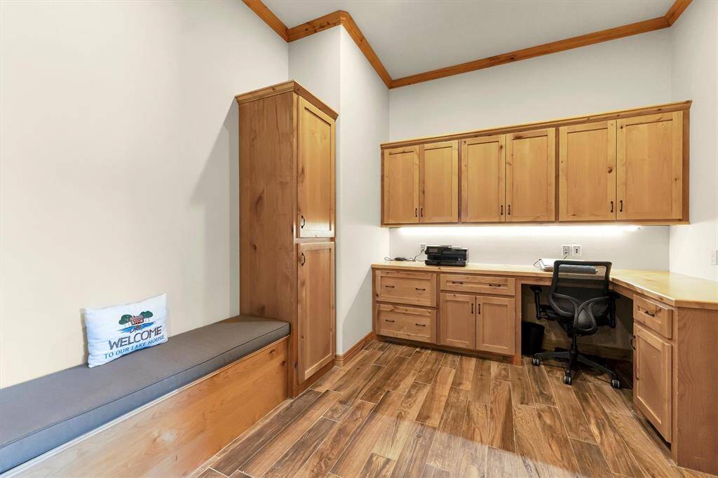 Keep everything in its place with a well-designed mud room offering plenty of storage, while the dedicated study provides a quiet, functional space with built-in shelving, a built-in desk, bright lighting, and extensive storage—ideal for work, school, or managing daily life.