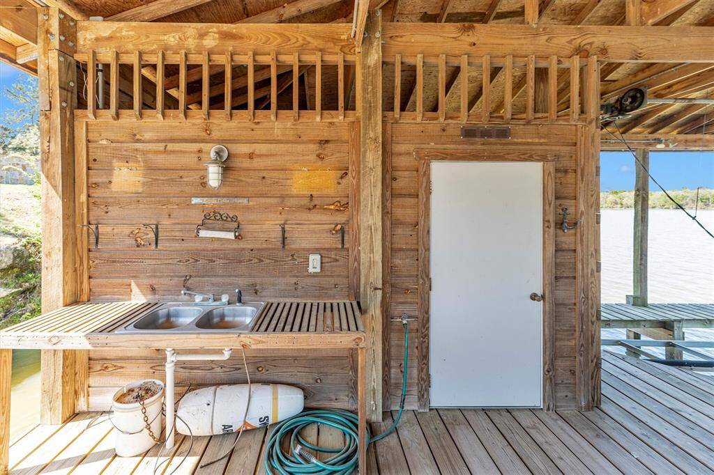 Easily clean your fresh catch at the dedicated fish cleaning station, then head to the nearby summer kitchen to cook up a delicious lakeside feast—ideal for effortless outdoor living and entertaining.