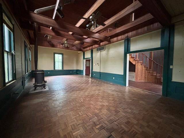 There is an open ceiling to make the living room so open.