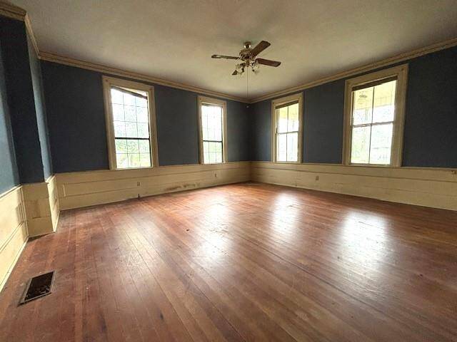 This home offers a first floor primary bedroom with walls of windows