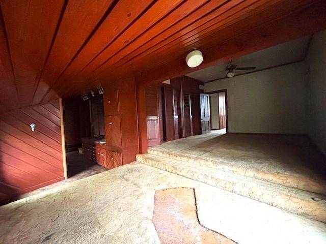 Other side of sitting area with door to bath