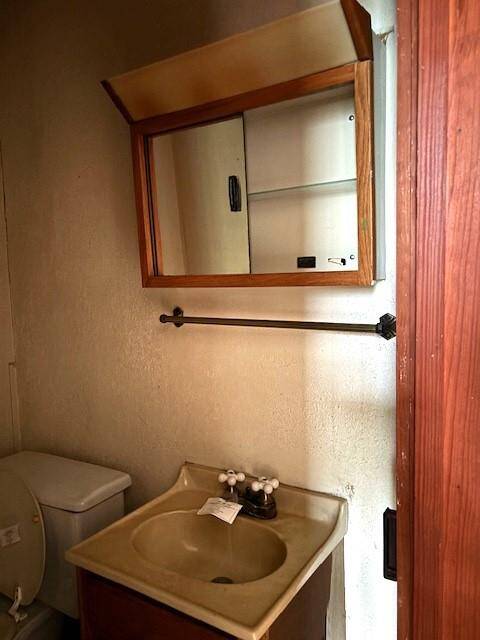 This half bath has access to the bedroom and landing.
