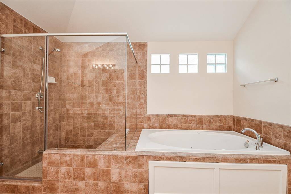 Note the darling windows above the tub. We have a hunch this will be your go-to spot when move-in day comes to a close.