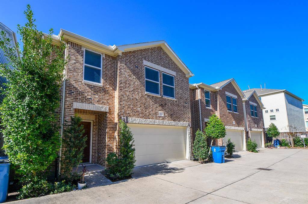 This fabulous, pristine, 2-story, brick RENTAL is the answer to your search and your dreams! It's located at 8763 Bryam Street, Houston, TX, in the Villas Monroe community. Shown here is the 2-vehicle attached garage and ample parking space.