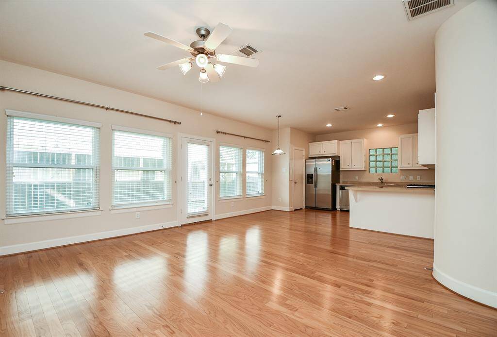 Glorious natural light fills the large, blended living/family area and kitchen.