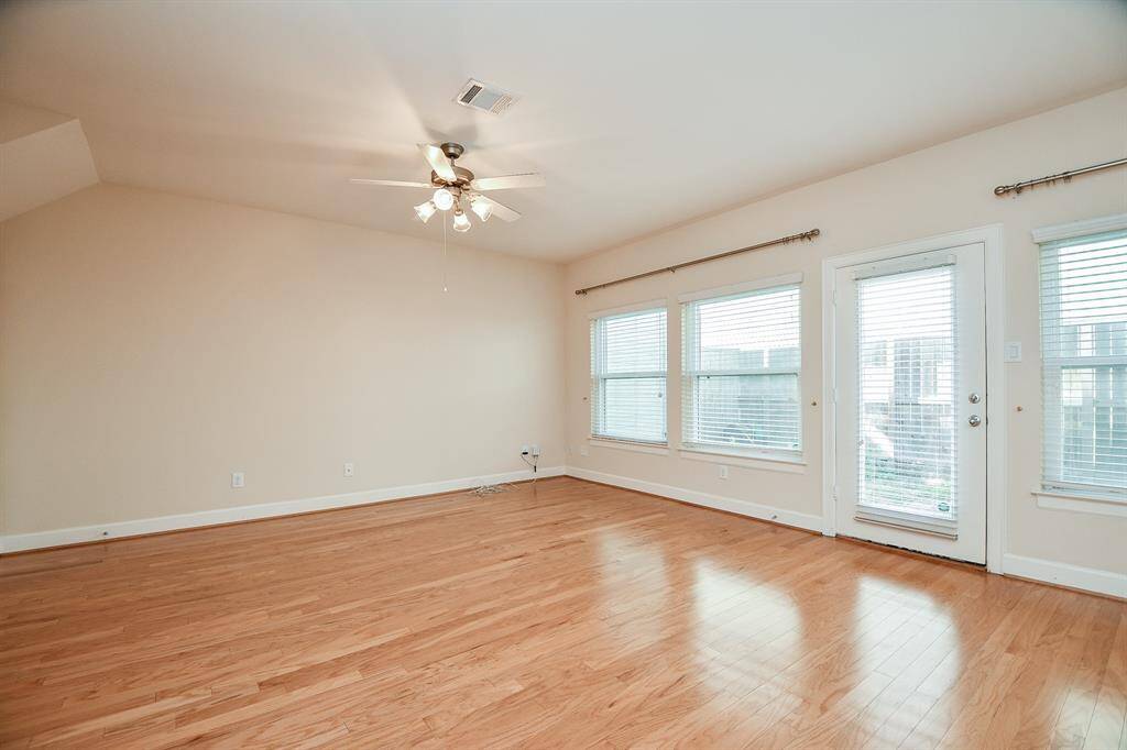 Walls of large windows provide natural outdoor 'murals' from this view, beyond the patio door.