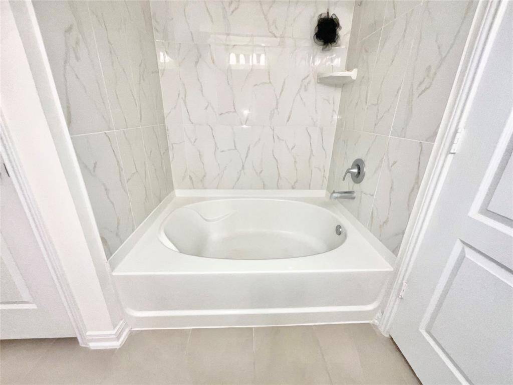 Primary Tub and Shower combo.