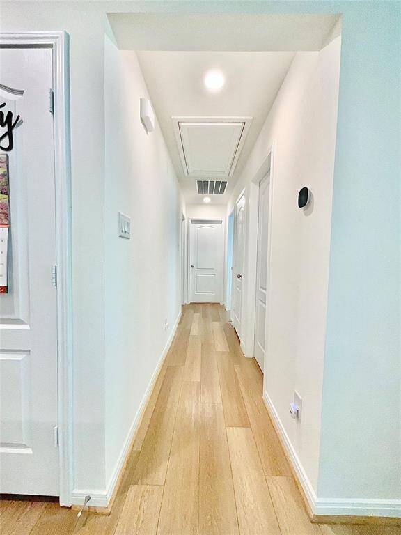 Hallway to other side of home where secondary bedrooms are located.